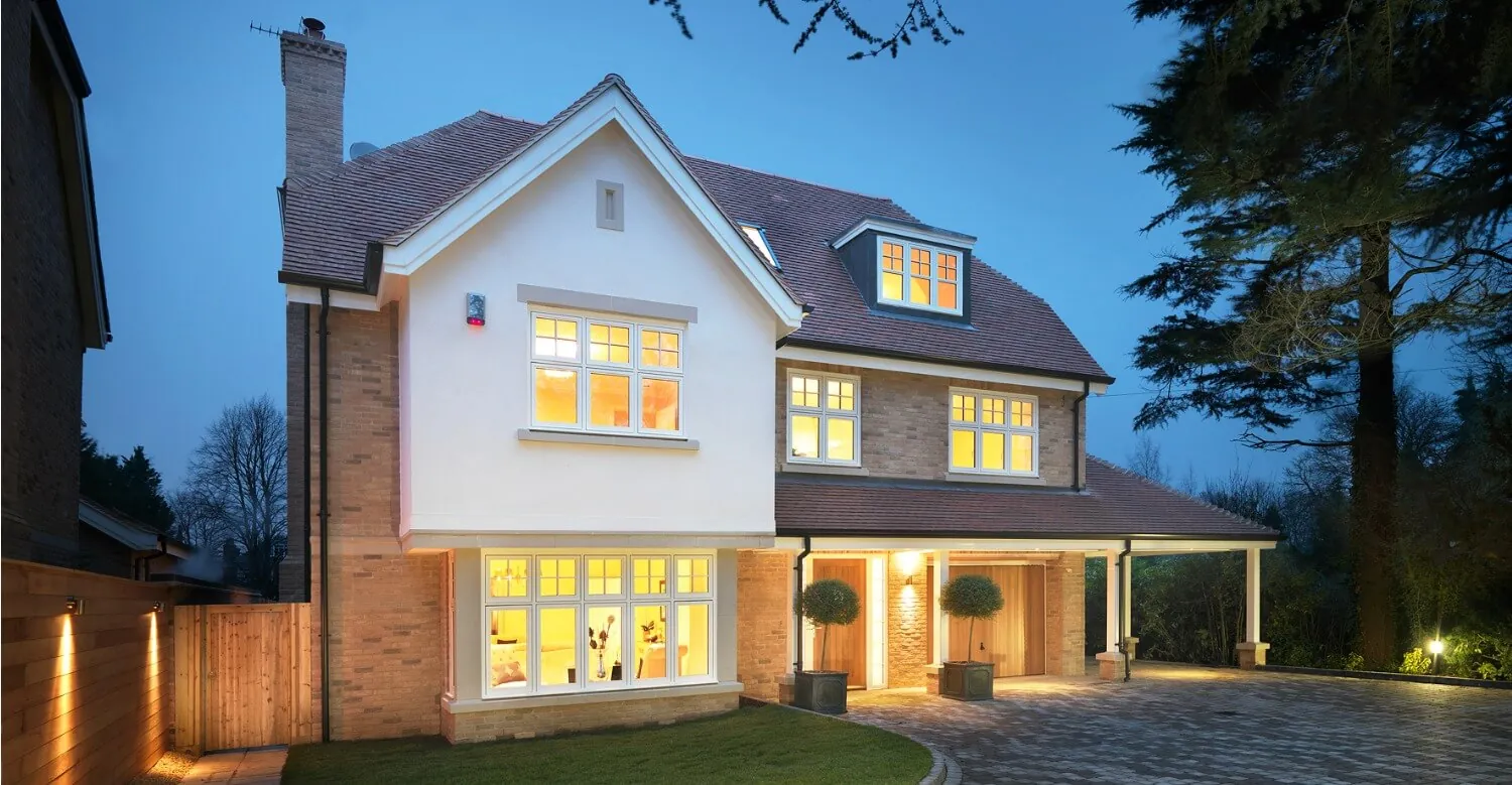 Two-storey rear house extension with orangery roof lanterns by Woodhams Builders