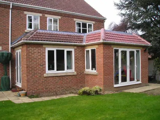 Rear house extension with bi-fold doors and patio, Hampshire