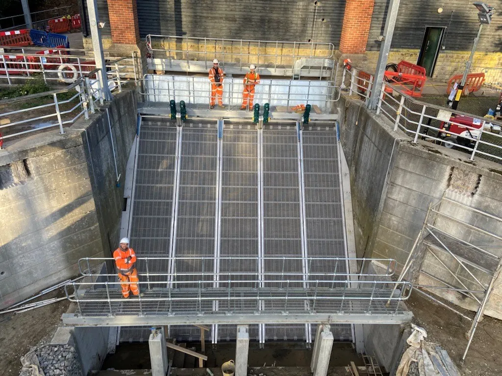 Galvanised handrail and mesh flooring bridge over an eel screen
