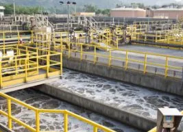 Aeration lanes at a wastewater treatment works with yellow handrails