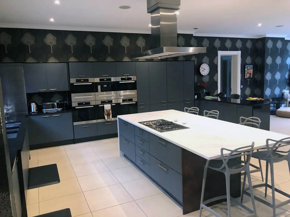 Kitchen redesign with dark units and breakfast bar