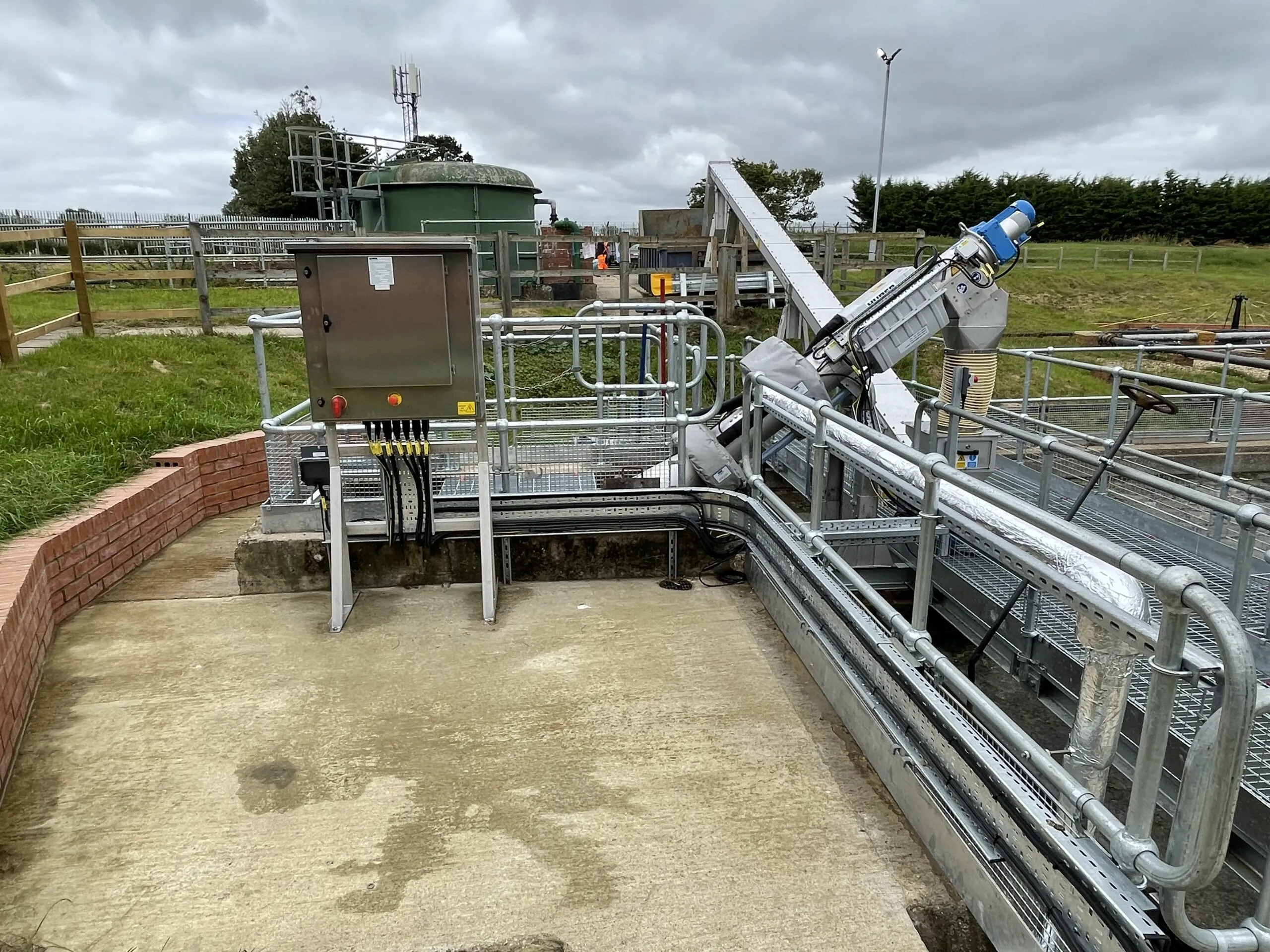 Galvanised steel walkway and handrails across treatment tanks