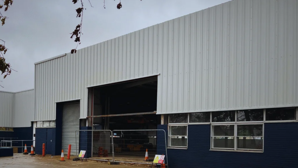 Industrial facility in Swindon with new roller shutter doors and cladding