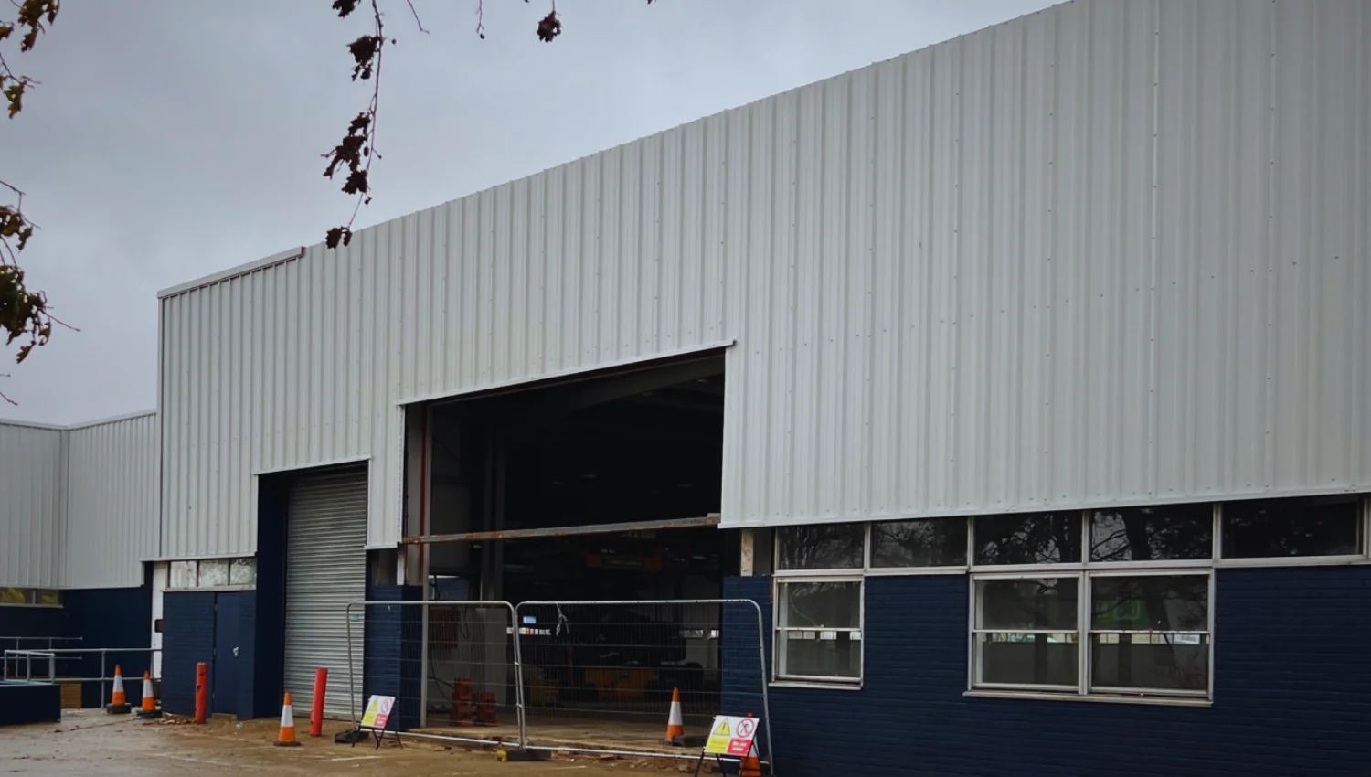 Industrial facility in Swindon with new roller shutter doors and cladding